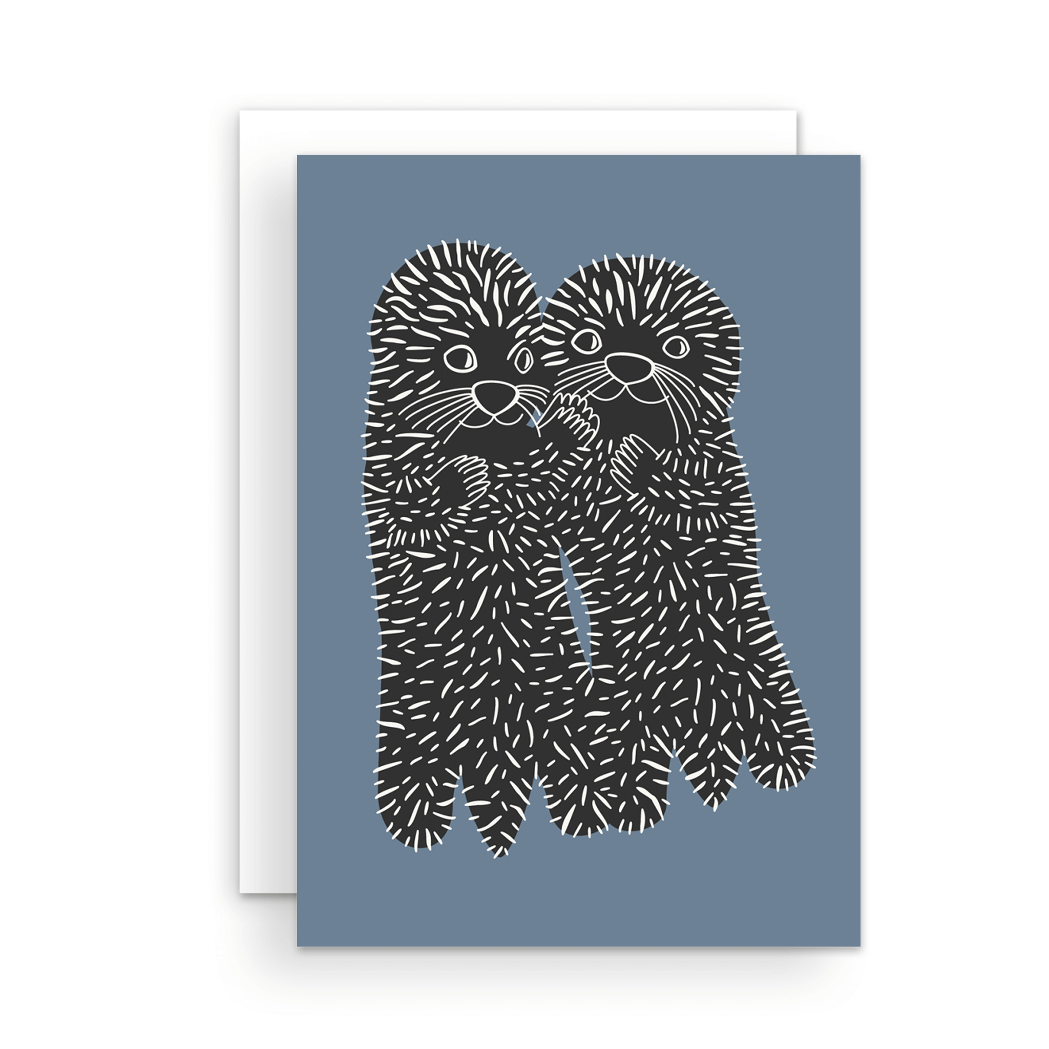Adorable sea otters greeting card, with two furry creatures holding hands, or I should say, paws. The card is blue with black and white animals.