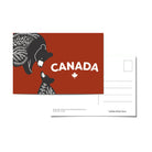 Canada postcard with an illustration of a black bear mama and cub and the word 'Canada' with a maple leaf on a red background